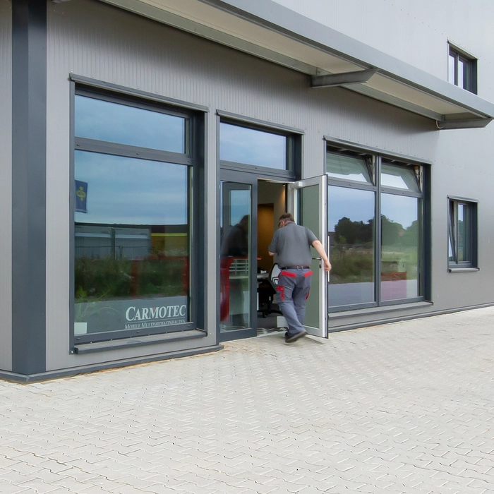 Entrance with shop window and glass doors